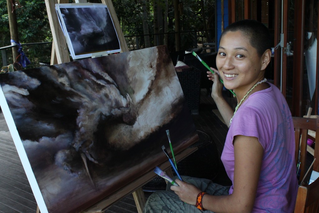 Yao working on her painting at Art in Paradise, Byron Bay